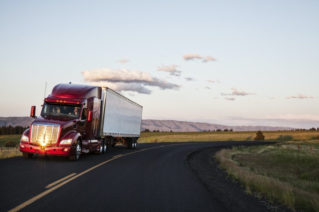 truck on a highway through the grasslands area of eastern Washington, USA.